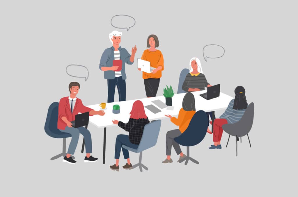 A group of people in office talking to each other in inclusive language